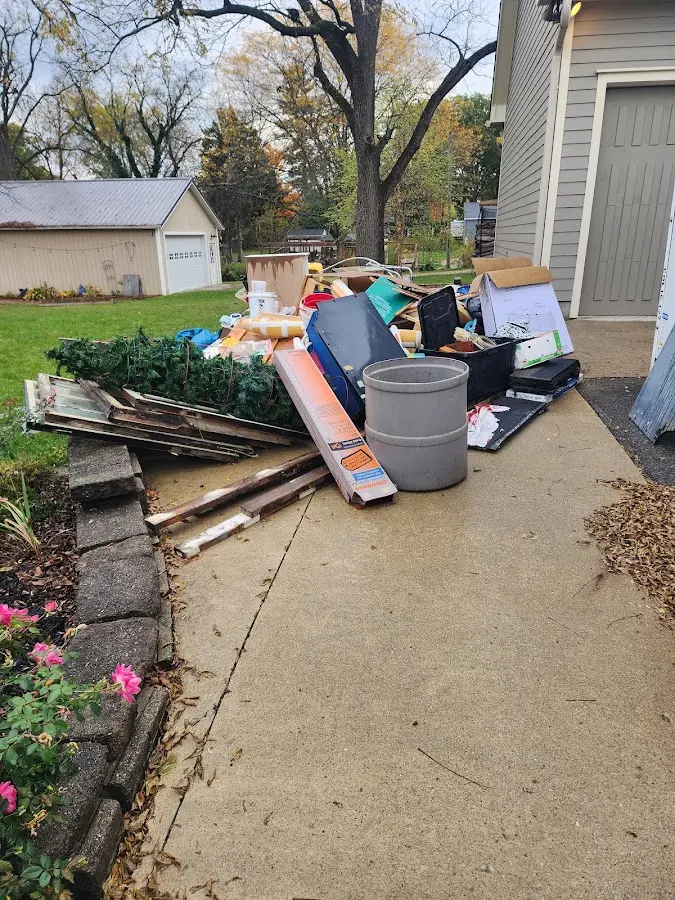 Dumpster being loaded with debris for 3 Yard Dumpster Rental in Del Monte Forest